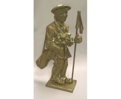 A cast brass doorstop in the form of a golfer (or caddy) with golf bags and flag CONDITION REPORTS Height is approx. 36.5 cm,