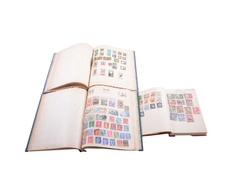 Two Swiftsure stamp albums containing a collection of world stamps; other schoolboy albums; stock books of mostly post-decima