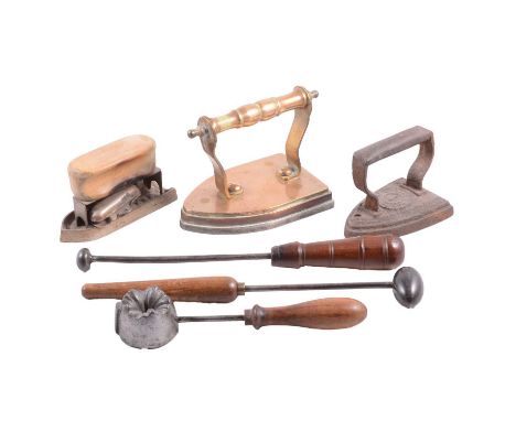 Collection of irons, including Chinese silk irons, flat irons, crimping iron, hat irons, etc, mostly 19th century.