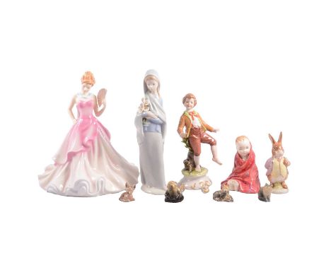 Small collection of ceramic figurines - Doulton, Lladro, Beswick Wade whimsies - and a small stained glass panel, oval, the c
