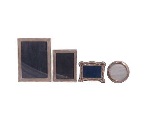 A silver-mounted photograph frame, import marks for P H Vogel &amp; Co, London 1975, engine-turned and beaded outlines, apert