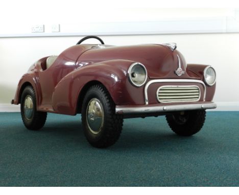 A rare Morris 1000 Junior pedal car, one of 56 built by the Morris Minor Centre of Bath in 1993 with glam fibre body and open