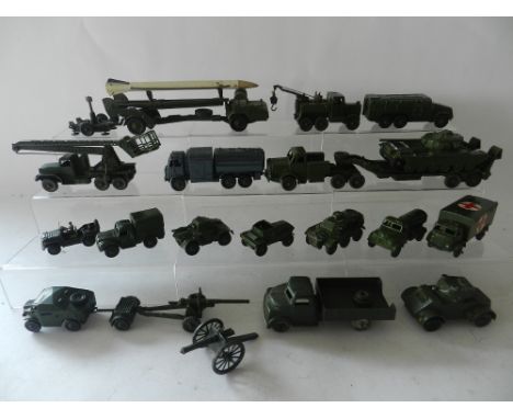 Twenty one unboxed Dinky army vehicles to include Missile launcher and rocket, tank transporter, RAF refueller and other item