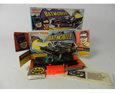 A boxed Corgi Toys No 267 Batmobile first issue, the model in unmarked gloss black finish and with 12 red rockets on original