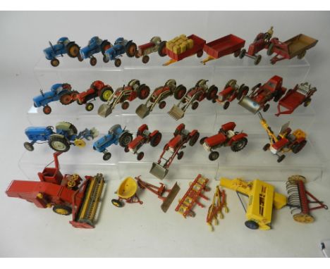 A large collection of diecast from equipment to include 14 tractors by Corgi, 1 Ertl, 1 Britains and 2 Dinky with a collectio