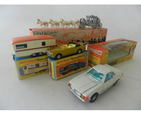 Four boxed toys to include a Coronation Coach by Barratt, a Corgi No 383 Mercedes Benz, a Matchbox No 69 Superfast Rolls Royc