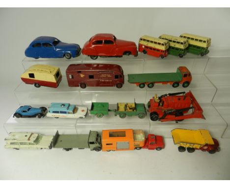 A group of unboxed Dinky toys dating frim the early 1950's to include Foden flat truck, Guy Otter, Horsebox, bulldozer 30' se