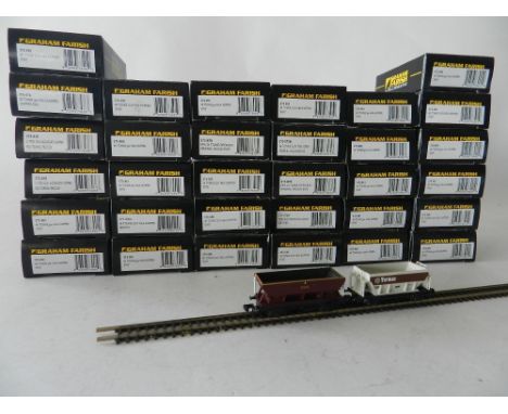 Thirty two boxed Graham Farish 2 axle hopper and mineral wagons liveries include those of AMC, Tarmac, EWS and others