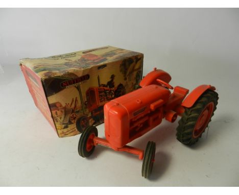 A part boxed Nuffield 'Universal Four' tractor by Raphael Lipkin circa 1955, the model in red plastic, missing drivers seat a