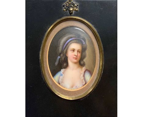 Continental School Portrait miniature of a lady in blue dress indistinctly inscribed to the reverseenamel8.5cm