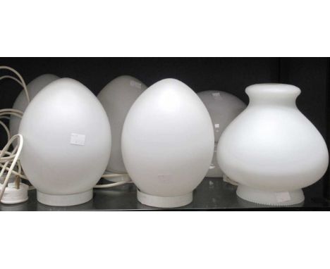 Four 1980's egg form white opaque glass lamps, together with one sectional ovoid lamp and a white glass shade (6)