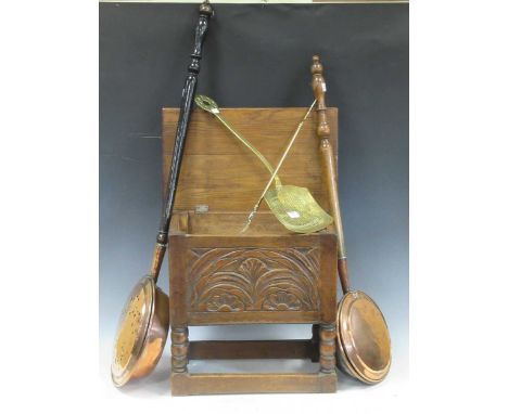 A 20th century oak box stool, two copper warming pans, a 19th century pierced brass skimmer and a fork (5)