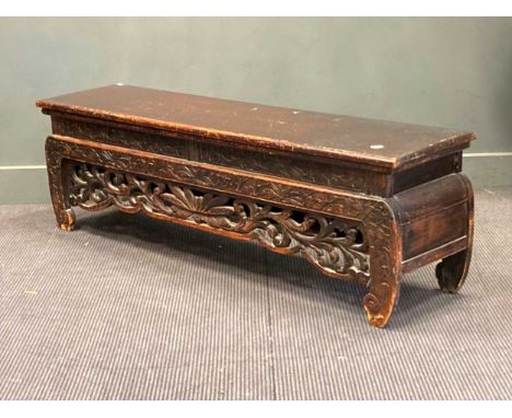 A far eastern carved and ebonised bench seat 45 x 146 x 37cm