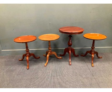 A Reproduction mahogany dish top tripod table stamped 'ARTHUR BRETT' and three other tripod tables (4)