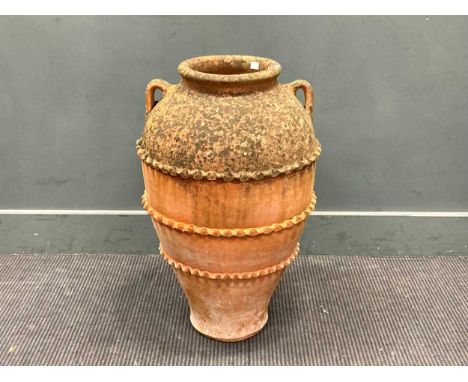A terracotta garden planter 68cm highMinor chipping to the protruding part of the shaped bands around the bodytop half is wea