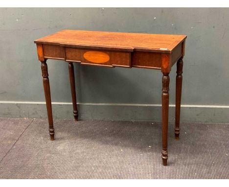 A breakfront mahogany console table on fluted legs76 x 91x 40cm