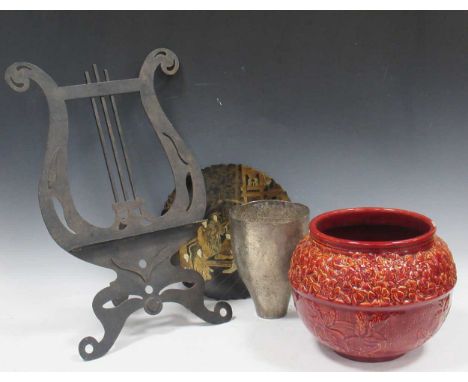 A Burmantofts Faience 'strawberry' ceramic jardiniere pot, a pierced lyre-shaped metal music stand, a papier-mache black lacq