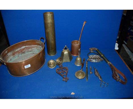 An oval Copper Planter and contents including Shell Cases, 1 pint Measure, ornate Stirrup, Bell, etc.