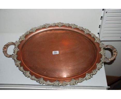 A large Copper centred two handled Tray having grape design surround