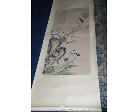 A large Chinese scroll Painting of birds and roses.