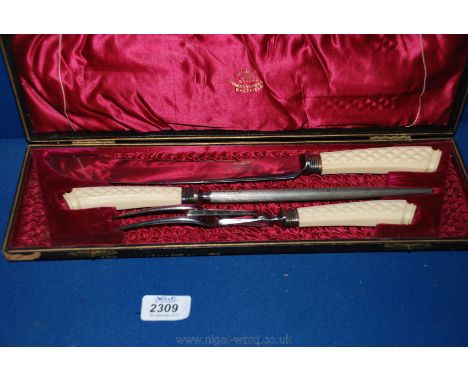A three piece boxed vintage Carving Set by Thomas Turner Sheffield with cream Bakelite handles