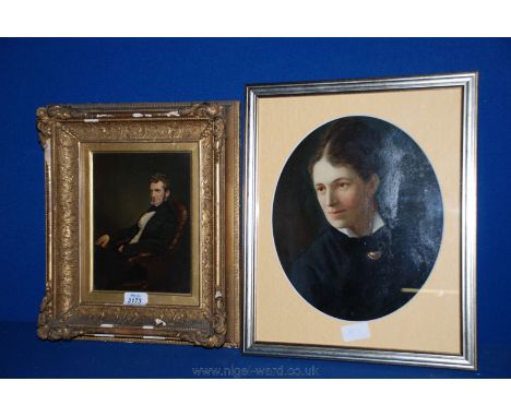 A late Victorian oval Oil portrait of a matronly looking woman in starched collars, signed upper right together with a Portra