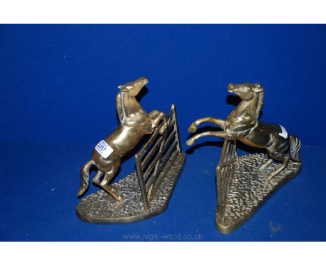 A pair of heavy Brass models of a Horse jumping a gate