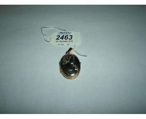 A 14k gold Italian Portrait Locket.