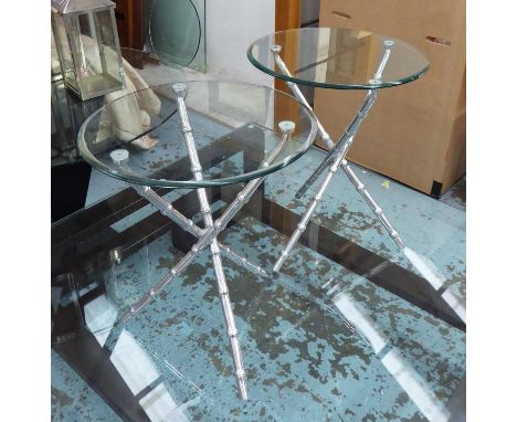 OCCASIONAL TABLES, a pair, the circular glass tops on polished metal faux bamboo tripod supports, each 50cm x 63cm H. (2)