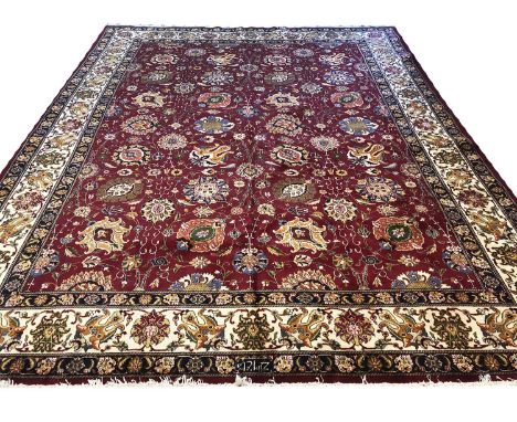 FINE SAFAVID SHAH ABBAS DESIGN TABRIZ CARPET, 382cm x 305cm, all over palmette and vine design on a ruby field within complim