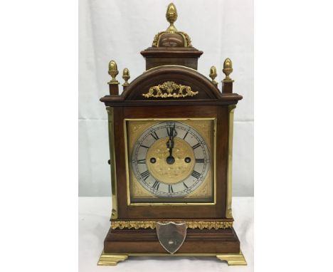 An eight-day movement bracket clock by Roskell &amp; Co, Liverpool with ornate mahogany and brass fitted case, with pierced s