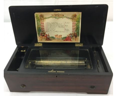 A 19th century eight-air music box in inlaid case in good working order: no damage to the comb