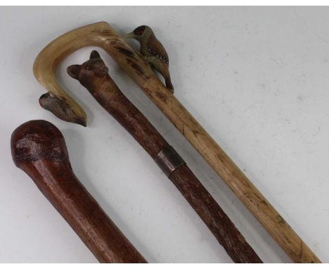 A mid-20th century walking staff, the tip carved as a fox head, the white metal collar engraved Old Berkeley Hounds 1952, 136