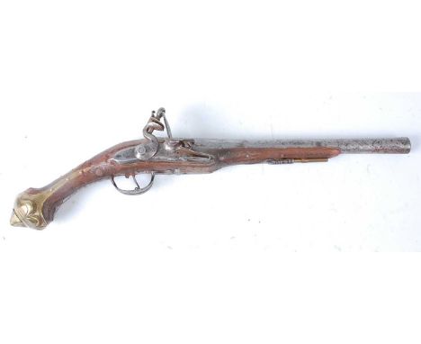 A 19th century Turkish flintlock pistol, having a 30cm barrel and engraved lock, the frame with circular swirling decoration 