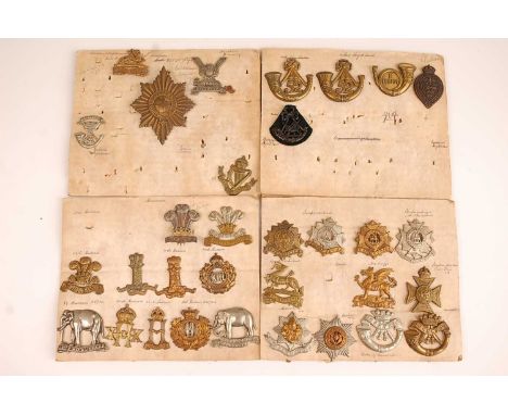 A collection of cap badges and insignia to include Royal Berkshire, Lowland Regiment, Connaught Rangers, Somerset Light Infan