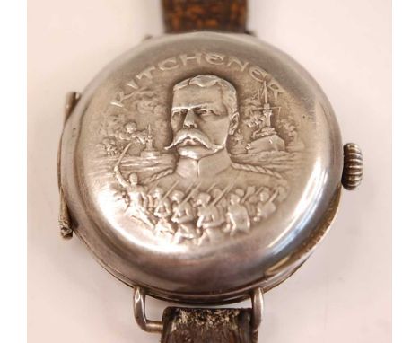 A WW I silver cased trench watch of full hunter type, the spring hinged cover embossed with a portrait of Earl Kitchener with