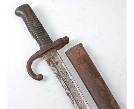 A French M1866 chassepot bayonet, having a 57cm single edged Yataghan shaped blade with a hooked quillon and ribbed brass gri