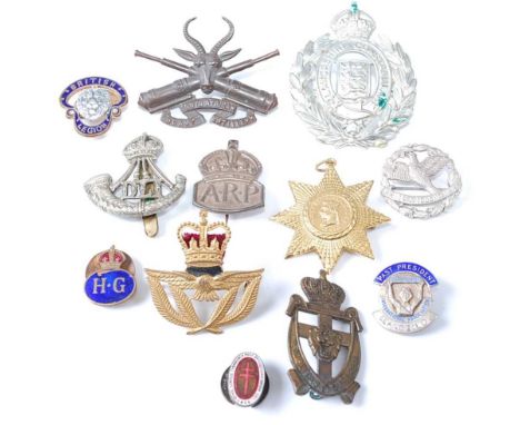 A collection of miscellaneous items to include South African Heavy Artillery and Durham light Infantry cap badges, a Lancashi