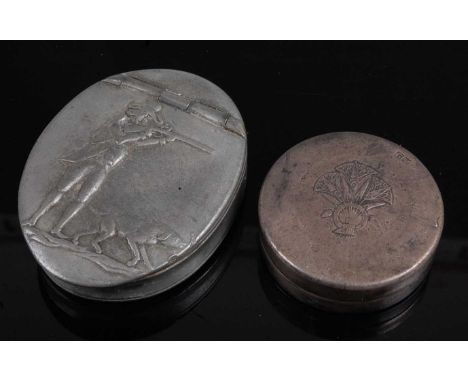 A pewter snuff box of oval form, the hinged cover relief decorated with a huntsman and hound, stamped verso G. Smith &amp; So