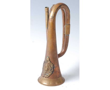 A copper and brass bugle with applied badge of the Argyll and Sutherland Highlanders.