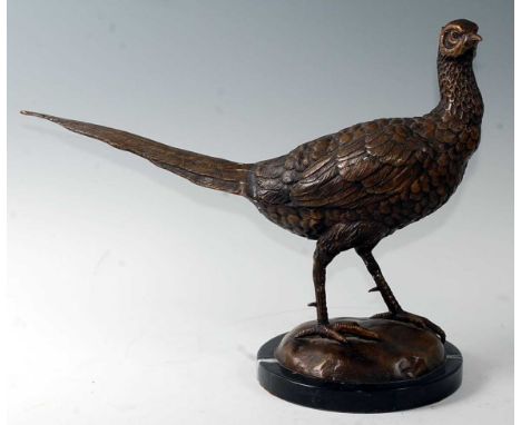A contemporary bronzed model of a pheasant in standing pose on a domed base and marble plinth, h.33cm.