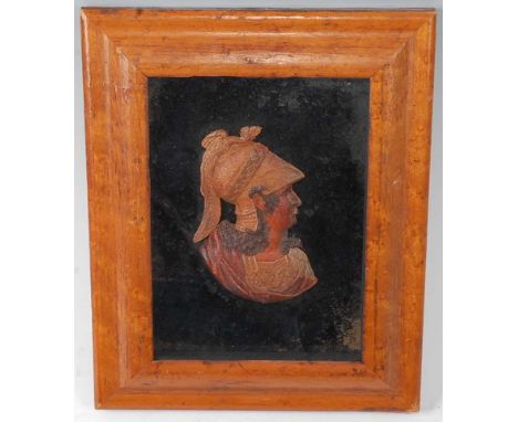 A 19th century wax head and shoulders portrait bust of a soldier, housed in a maple frame, bust 11 x 7.5cm, max dimensions 25