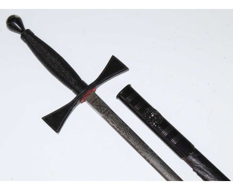 A Masonic Ceremonial sword, the 71cm flattened oval blade marked Wilkinson Sword Ltd, with a plain crossguard and wire bound 