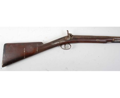 A 19th century percussion sporting gun, the 80cm barrel engraved indistinctly to the top rib, having an engraved dolphin hamm