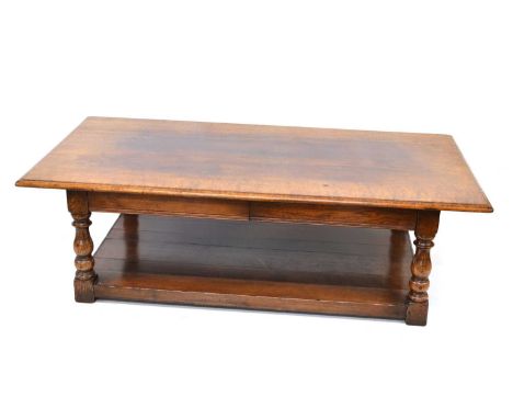 Mid-20th-century oak coffee table, probably made by Titchmarsh &amp; Goodwin, rectangular top with moulded edge, supported on