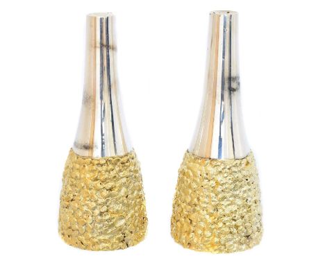 A pair of silver salt and pepper pots, Stuart Devlin, London, 1970, height 10.8cm, gross weight 6.72ozt.Condition report: Ove