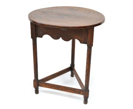 Late 19th-century oak cricket table, circular three plank top supported on tri-form base with wavy fretwork frieze, turned le