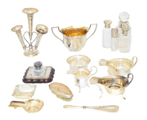 A selection of silver, to include an epergne, inkwell, sauce boats, silver lidded jars, etc, gross weight of solid silver ite