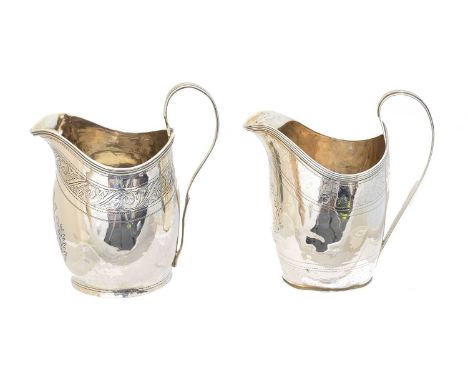 A silver milk jug, with Chester hallmarks, together with one other, unmarked, heights 12.2 and 13cm, gross weight of hallmark