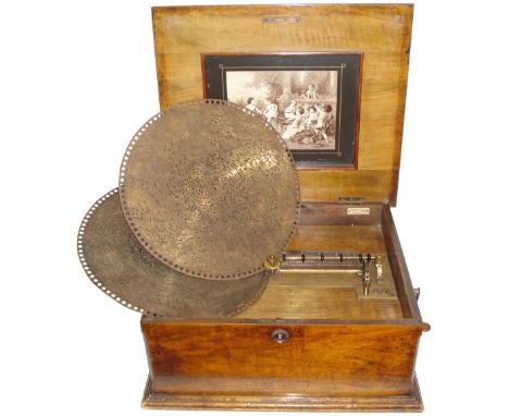 A 15.5/8-inch Polyphon disc musical box,Style 43B, Ser. No. 85334,With single comb, titled gilt cast bedplate, Putti in garde
